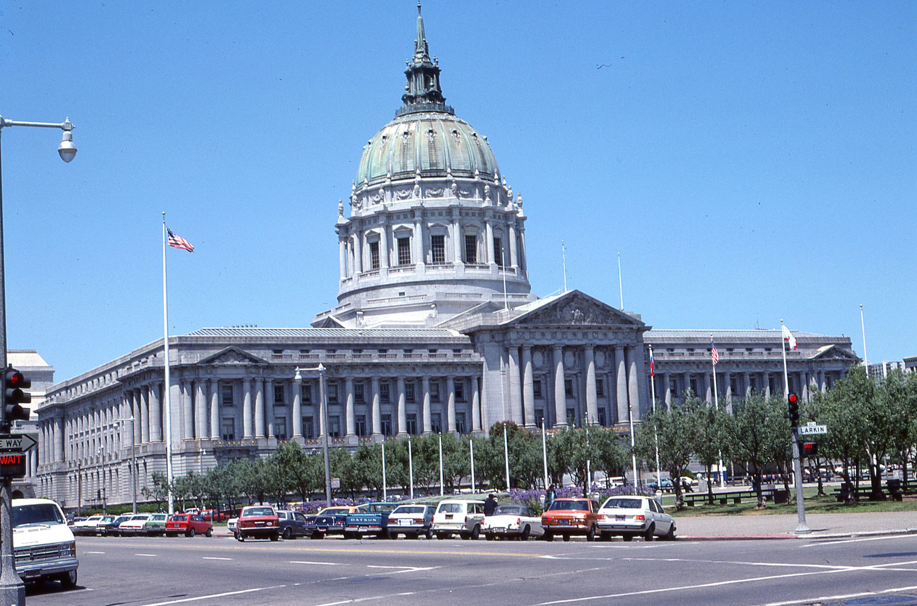 San Francisco City Hall's grand architecture under a clear blue sky, showcasing its iconic dome.